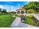 Scenic view of a gazebo in a park setting with lush green grass at 225 Randolph Rd, Venice, FL 34293