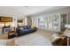 Inviting living room with large windows, comfortable seating, and bright neutral colors at 225 Randolph Rd, Venice, FL 34293