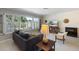 Inviting living room with large windows, plantation shutters and comfortable seating at 225 Randolph Rd, Venice, FL 34293