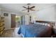 Bedroom featuring a ceiling fan, sliding glass doors to the patio, and natural light at 225 Randolph Rd, Venice, FL 34293