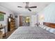 Spacious main bedroom with a ceiling fan, sliding glass doors to the patio, and natural light at 225 Randolph Rd, Venice, FL 34293
