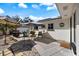 The patio has an outdoor kitchen and umbrella covered seating area for entertaining and relaxing at 225 Randolph Rd, Venice, FL 34293