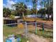 Spacious backyard area with a chain-link fence and scattered debris, requiring cleanup and landscaping at 2863 Twinkle Ave, North Port, FL 34286