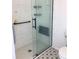 Modern bathroom featuring a frameless glass shower, grab bar, and eye-catching tilework at 2863 Twinkle Ave, North Port, FL 34286