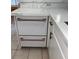 Kitchen detail featuring a white dishwasher with bronze hardware accents at 2863 Twinkle Ave, North Port, FL 34286