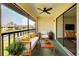 Relaxing balcony with outdoor furniture, decor, a view of the lake and ceiling fan at 345 Three Lakes Ln # L, Venice, FL 34285
