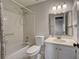 Bathroom with tub and shower combination and single sink vanity at 345 Three Lakes Ln # L, Venice, FL 34285