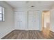 Bedroom features ample closet space with bi-fold doors at 345 Three Lakes Ln # L, Venice, FL 34285
