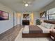 Bedroom with wood-look floors and modern furnishings at 345 Three Lakes Ln # L, Venice, FL 34285