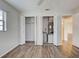 Bedroom closet showing interior with storage space and a water heater at 345 Three Lakes Ln # L, Venice, FL 34285