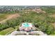 Overhead view of community center with pool and lush landscape, surrounded by greenery at 4210 Vicenza Dr # A25, Venice, FL 34293