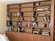 Bedroom features stylish built-in shelving for storage and display at 424 Shade Ter, Venice, FL 34293