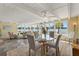 Bright sunroom with multiple seating areas and lake views at 424 Shade Ter, Venice, FL 34293