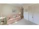 Comfortable bedroom with a soft sofa, ample closet space, and a serene atmosphere at 630 Bird Bay E Dr # 208, Venice, FL 34285