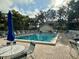 Enjoy the outdoors at the inviting community pool, surrounded by comfortable lounge chairs at 630 Bird Bay E Dr # 208, Venice, FL 34285