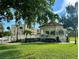 Picturesque white gazebo on manicured lawn, with benches to enjoy community's lush landscape at 630 Bird Bay E Dr # 208, Venice, FL 34285