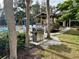 Outdoor barbecue grill situated next to community pool at 630 Bird Bay E Dr # 208, Venice, FL 34285
