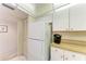 Clean kitchen features white appliances and ample counter space and cabinet space at 630 Bird Bay E Dr # 208, Venice, FL 34285