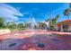 A vibrant splash pad featuring interactive water fountains and shaded seating for community enjoyment at 630 Bird Bay E Dr # 208, Venice, FL 34285