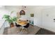 Bright dining area with stylish black chairs, a decorative sideboard, and an eye-catching pendant light at 638 Bird Bay E Dr # 201, Venice, FL 34285