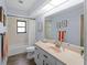Clean bathroom featuring a bathtub, shower, and a large mirror at 8 Bunker Ln, Rotonda West, FL 33947
