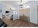 Welcoming entryway showcasing a stylish light fixture and an open view to the living room at 8 Bunker Ln, Rotonda West, FL 33947