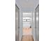 Hallway view into bathroom featuring a soaking tub under window, quartz countertop, and modern fixtures at 8 Bunker Ln, Rotonda West, FL 33947