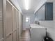 Well-equipped laundry room with ample storage cabinets and modern washer and dryer at 8 Bunker Ln, Rotonda West, FL 33947