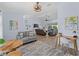 Bright living room featuring modern lighting, comfortable seating and an open floor plan at 8 Bunker Ln, Rotonda West, FL 33947