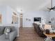 Bright and airy living room showcasing vaulted ceilings, contemporary decor, and ample seating for gatherings at 8 Bunker Ln, Rotonda West, FL 33947