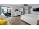 Spacious main bedroom with a ceiling fan, sliding glass door, and en suite bathroom at 8 Bunker Ln, Rotonda West, FL 33947
