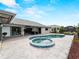 Tranquil backyard featuring a refreshing pool and attached spa, perfect for relaxation and outdoor enjoyment at 8 Bunker Ln, Rotonda West, FL 33947