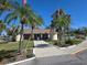 Charming community building framed by palm trees, featuring a welcoming entrance and well-maintained landscaping at 88 Bainbridge Dr # 88, Nokomis, FL 34275