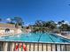 Inviting community pool surrounded by lounge chairs and lush landscaping, perfect for relaxation and recreation at 88 Bainbridge Dr # 88, Nokomis, FL 34275