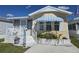 Inviting single-Gathering home with a cozy screened porch and pretty landscaping at 88 Bainbridge Dr # 88, Nokomis, FL 34275