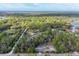 Aerial view of property surrounded by lush trees with a white boundary line at 964 1St Dirt Rd, Venice, FL 34292