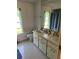Functional bathroom features a double sink vanity, ample counter space, and classic fixtures at 964 1St Dirt Rd, Venice, FL 34292