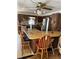 Vintage kitchen with wood cabinets, a bar countertop, and an eat-in breakfast nook for casual dining at 964 1St Dirt Rd, Venice, FL 34292