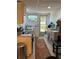 Efficient kitchen features a modern sink, sleek appliances, and natural light streaming through the exterior door at 964 1St Dirt Rd, Venice, FL 34292