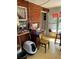 Mud room with lots of storage, wood walls, white framed windows and a chair at 964 1St Dirt Rd, Venice, FL 34292