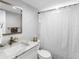 Clean bathroom with a shower/tub combo, vanity, and neutral color scheme at 995 Laguna Drive # 303, Venice, FL 34285