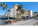Exterior shot of the condo building, showing balconies, landscaping, and parking areas, blending convenience and coastal living at 995 Laguna Drive # 303, Venice, FL 34285