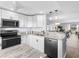 Modern kitchen with stainless steel appliances, granite countertops, and an open design, perfect for cooking and entertaining guests at 995 Laguna Drive # 303, Venice, FL 34285