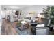Bright living room with a plush sofa, decorative pillows, art, and large windows for natural light, creating a warm ambiance at 995 Laguna Drive # 303, Venice, FL 34285