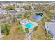 Scenic aerial view of community featuring pool, pond, and well-maintained buildings at 1051 Forrest Nelson Blvd # A-103, Port Charlotte, FL 33952
