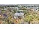 Aerial view of condo building surrounded by trees and overlooking the community at 1051 Forrest Nelson Blvd # A-103, Port Charlotte, FL 33952