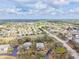 Expansive aerial view of the residential community with tree-lined streets and well-manicured lawns at 1051 Forrest Nelson Blvd # A-103, Port Charlotte, FL 33952