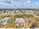 Overhead aerial view of the condo building nestled among trees and near the community at 1051 Forrest Nelson Blvd # A-103, Port Charlotte, FL 33952