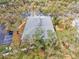 Aerial view of the condo building roof, surrounded by lush greenery and trees at 1051 Forrest Nelson Blvd # A-103, Port Charlotte, FL 33952