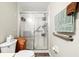 Bright bathroom featuring a glass-enclosed shower, ample towel bars and neutral colors at 1051 Forrest Nelson Blvd # A-103, Port Charlotte, FL 33952
